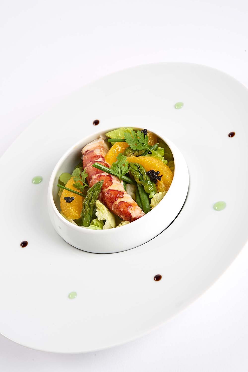 Boréal de homard aux agrumes en salade gourmande